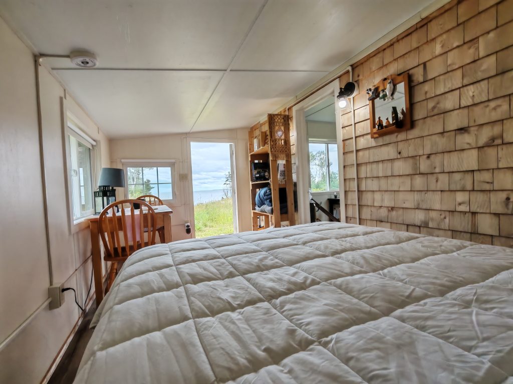 Bed with Cedar Shingle wall and Ocean View