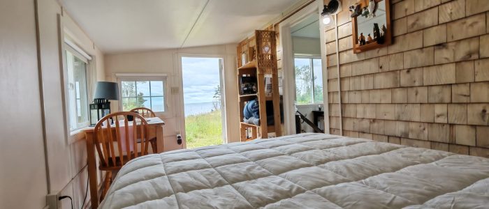 Bed with Cedar Shingle wall and Ocean View